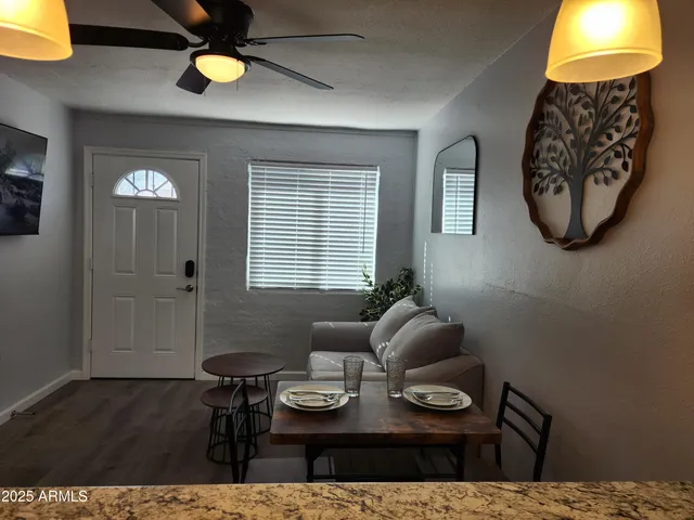 a living room with furniture and a table