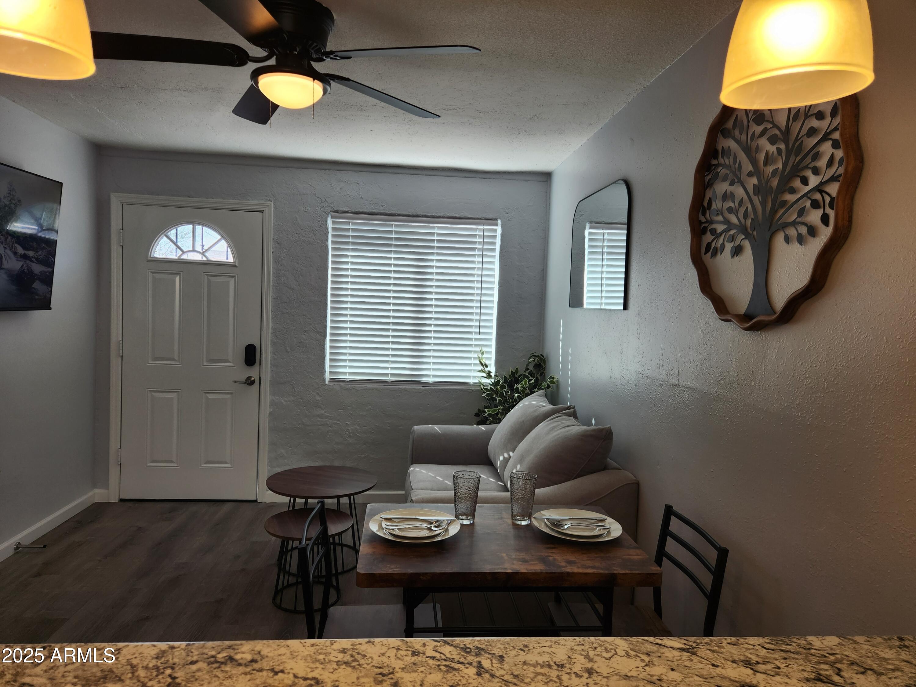 299 South Oregon Street, Unit 4 Chandler, AZ 85225 - Photo 31 of 39 a living room with furniture and a table