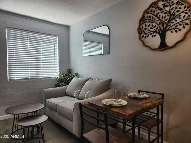 a living room with furniture and a window
