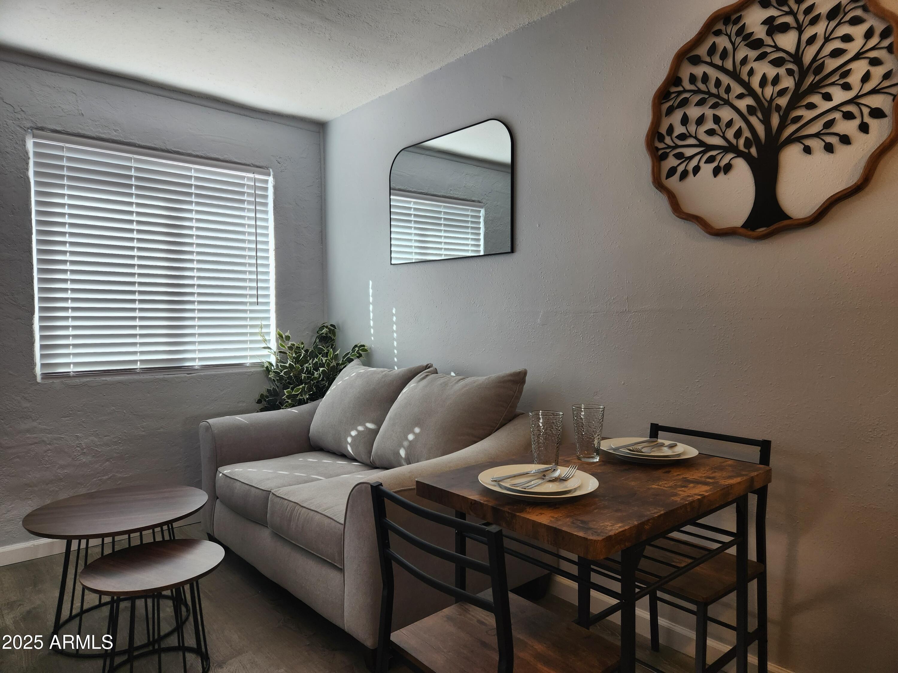 299 South Oregon Street, Unit 4 Chandler, AZ 85225 - Photo 32 of 39 a living room with furniture and a window