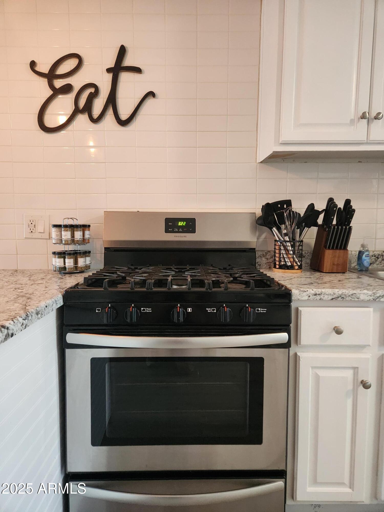 299 South Oregon Street, Unit 4 Chandler, AZ 85225 - Photo 37 of 39 a stove top oven sitting inside of a kitchen