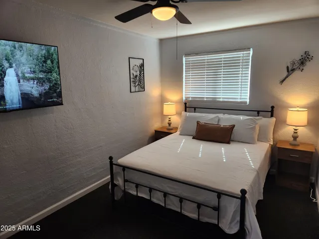 a view of a room that has a table and chairs in it