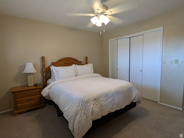 1411 Millbrook Way Bountiful, UT 84010 - Photo 23 of 36 Carpeted bedroom featuring a ceiling fan with light fixture and bi-fold closet doors