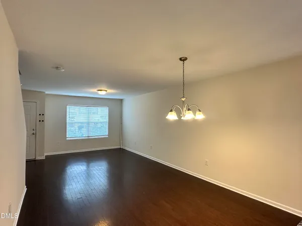 a view of a room with window wooden floor and a ceiling fan