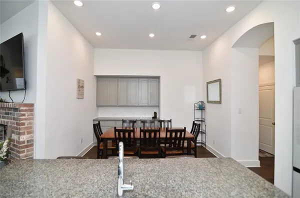a dining room with furniture and entryway