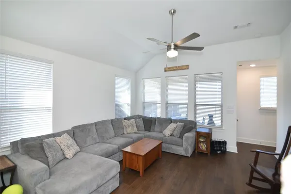 a living room with furniture and a large window
