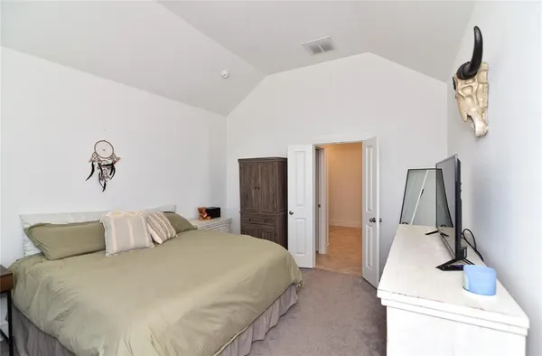 a bedroom with a bed and a sink