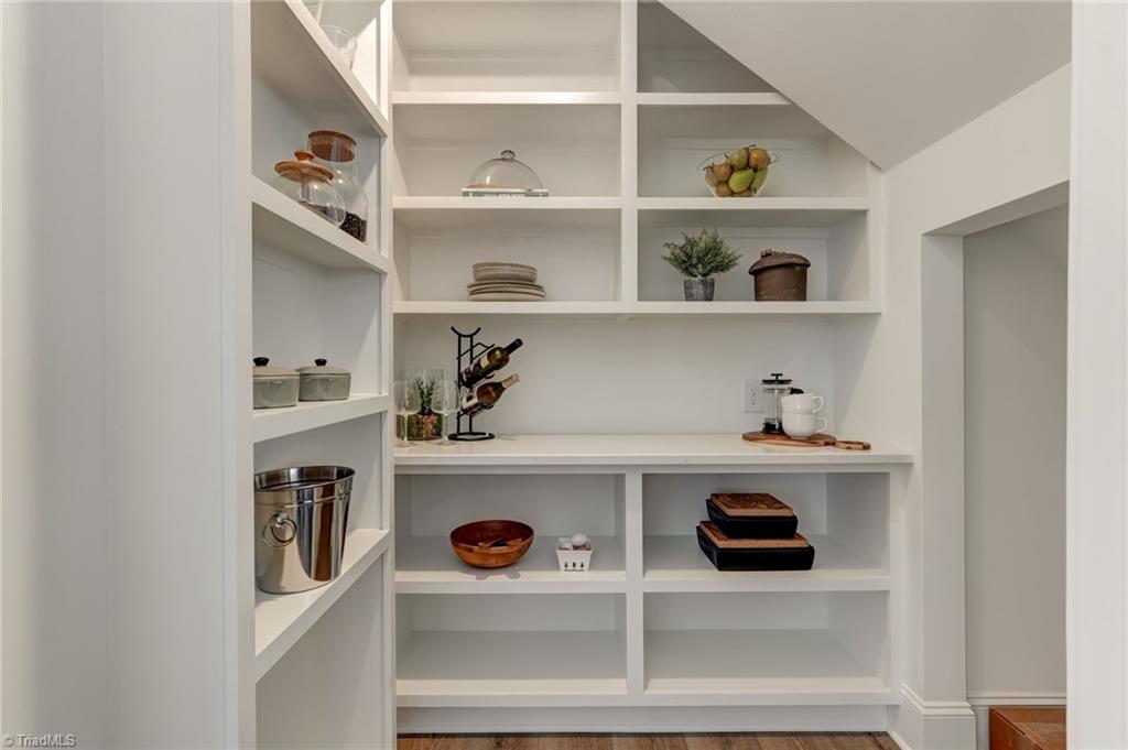 6806 Brennan Way Oak Ridge, NC 27310 - Photo 15 of 50 walk in pantry - space galore! Cubby on the right offers additional storage for your bulk products or a deep freezer