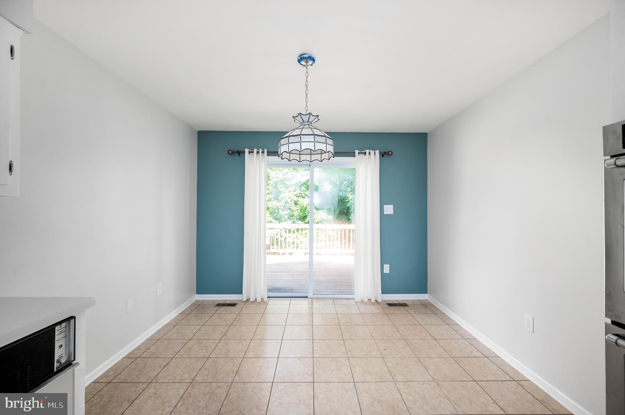 8202 Rushing Creek Drive Springfield, VA 22153 - Photo 12 of 44 Breakfast room with ceramic tile, SGD to deck