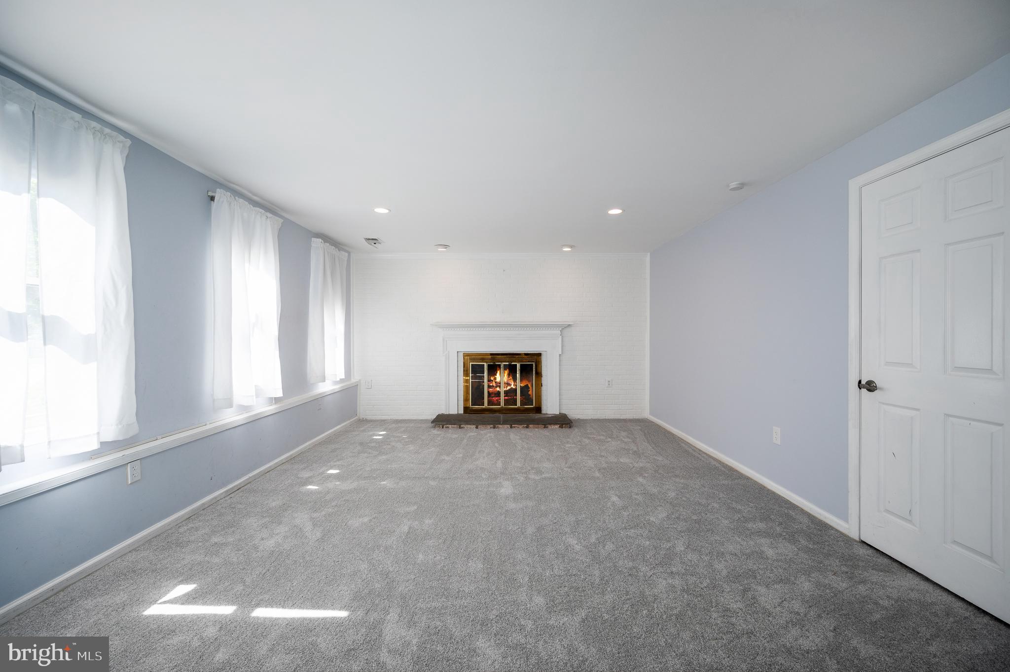 8202 Rushing Creek Drive Springfield, VA 22153 - Photo 30 of 44 Wood burning fireplace, daylight windows