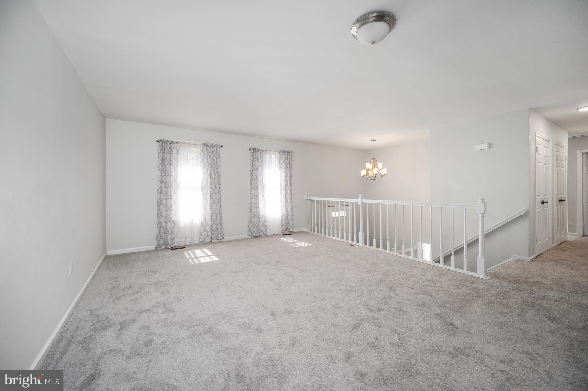 8202 Rushing Creek Drive Springfield, VA 22153 - Photo 9 of 44 View of living room, entry stairs and bedroom hall