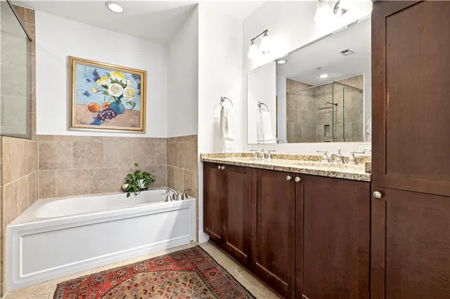 a bathroom with a bathtub and a sink