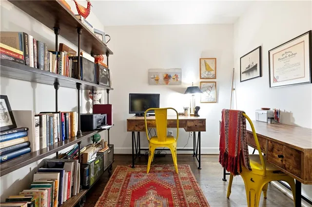 a view of a workspace with furniture and toys