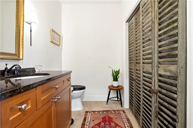 a kitchen that has a sink and a stove