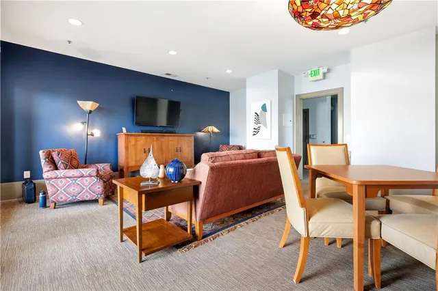 a living room with furniture and a rug