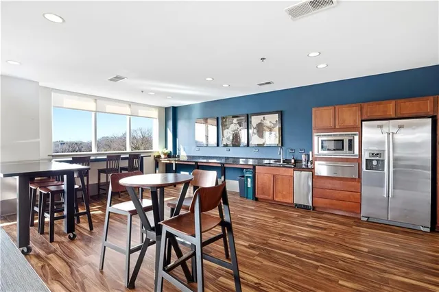 a kitchen with a table and chairs in it
