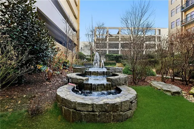 a view of a fountain in middle of the house