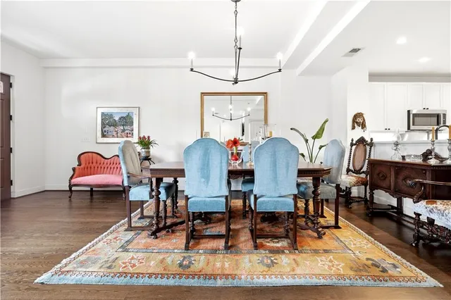 a living room with lots of furniture and a wooden floor