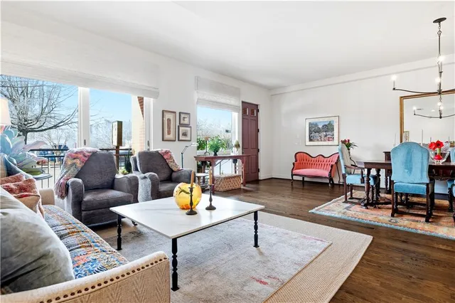 a living room with furniture and a table