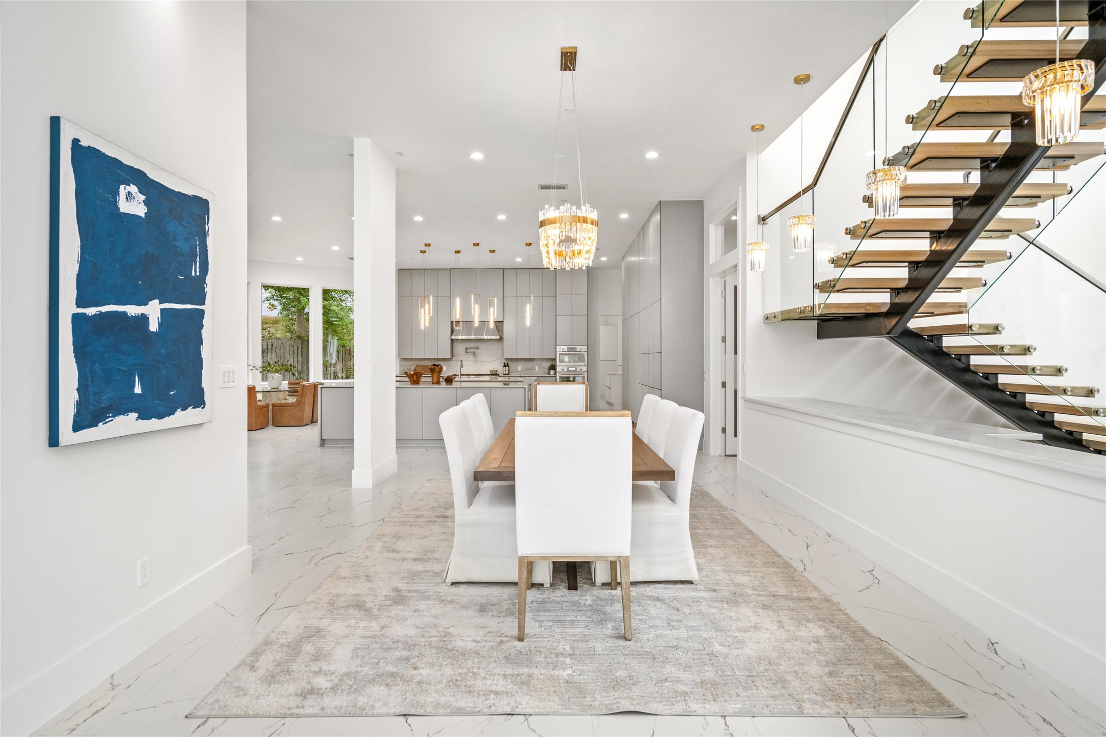 625 Piney Point Road Houston, TX 77024 - Photo 6 of 42 a dining room with a table and chairs