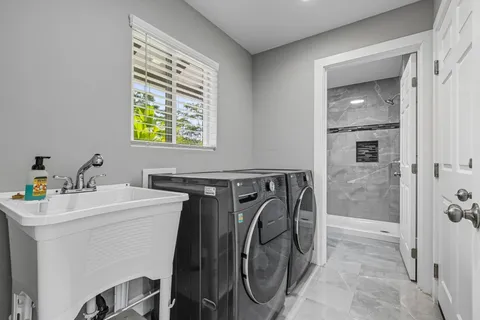 a utility room with dryer and washer