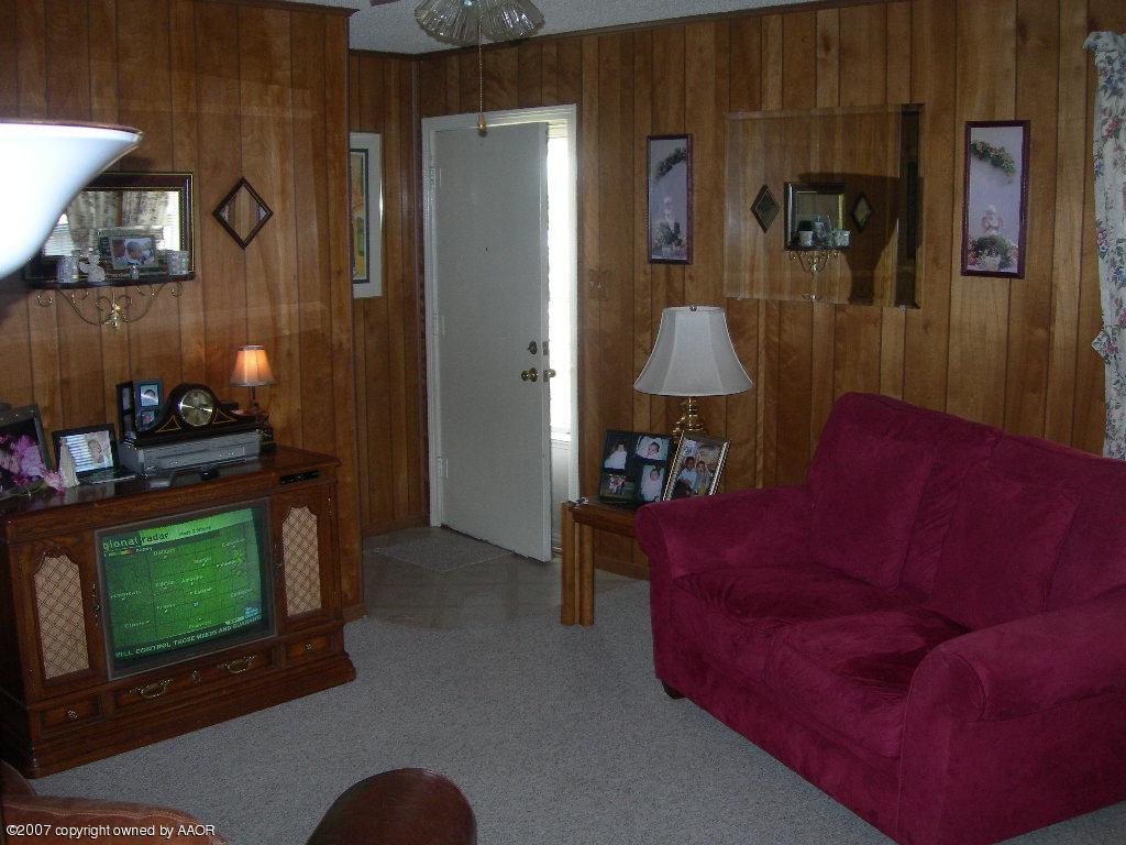 4601 Cline Road Amarillo, TX 79110 - Photo 2 of 9 a living room with furniture and a fireplace