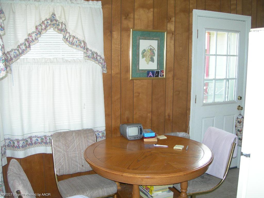 4601 Cline Road Amarillo, TX 79110 - Photo 3 of 9 a view of a dining room with furniture and wooden floor