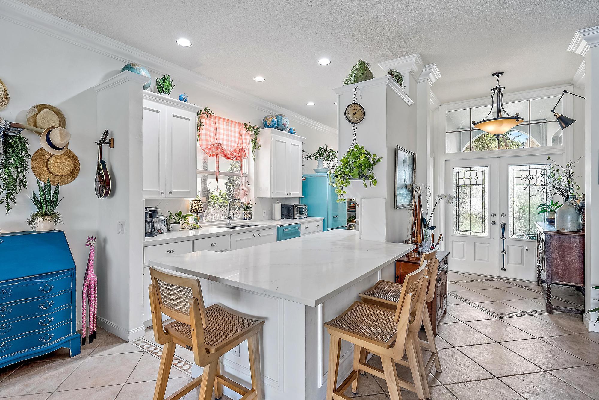 115 South Hampton Drive Jupiter, FL 33458 - Photo 19 of 27 a view of dining table chairs and window