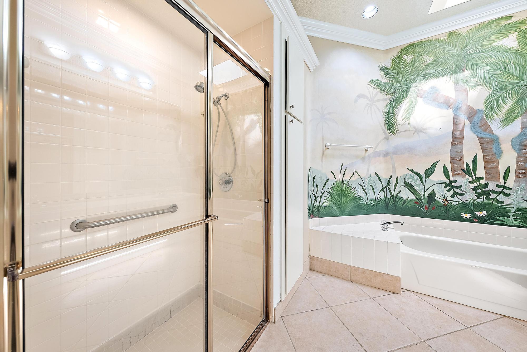 115 South Hampton Drive Jupiter, FL 33458 - Photo 23 of 27 a bathroom with a bathtub and a shower