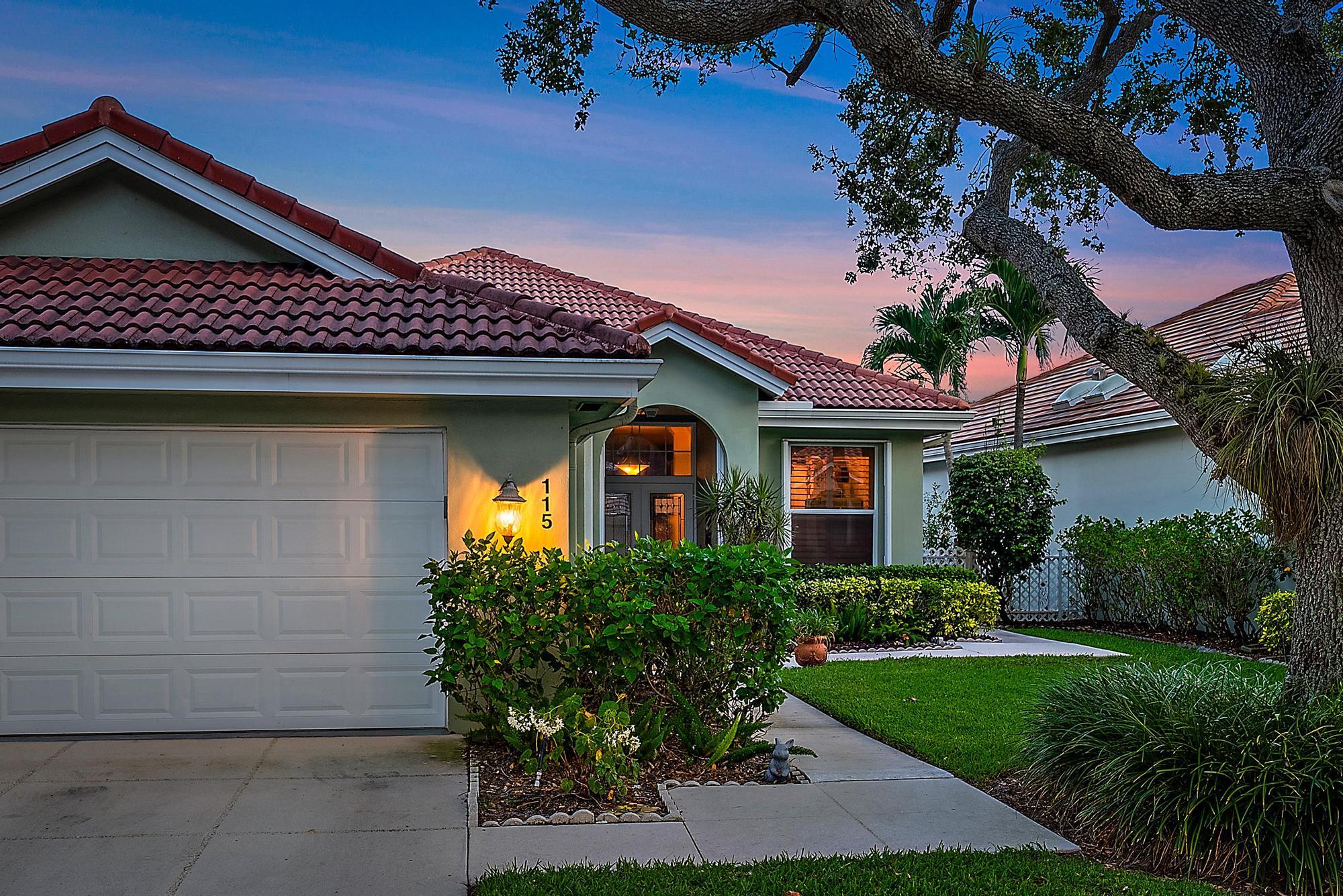 115 South Hampton Drive Jupiter, FL 33458 - Photo 4 of 27 a front view of a house with garden