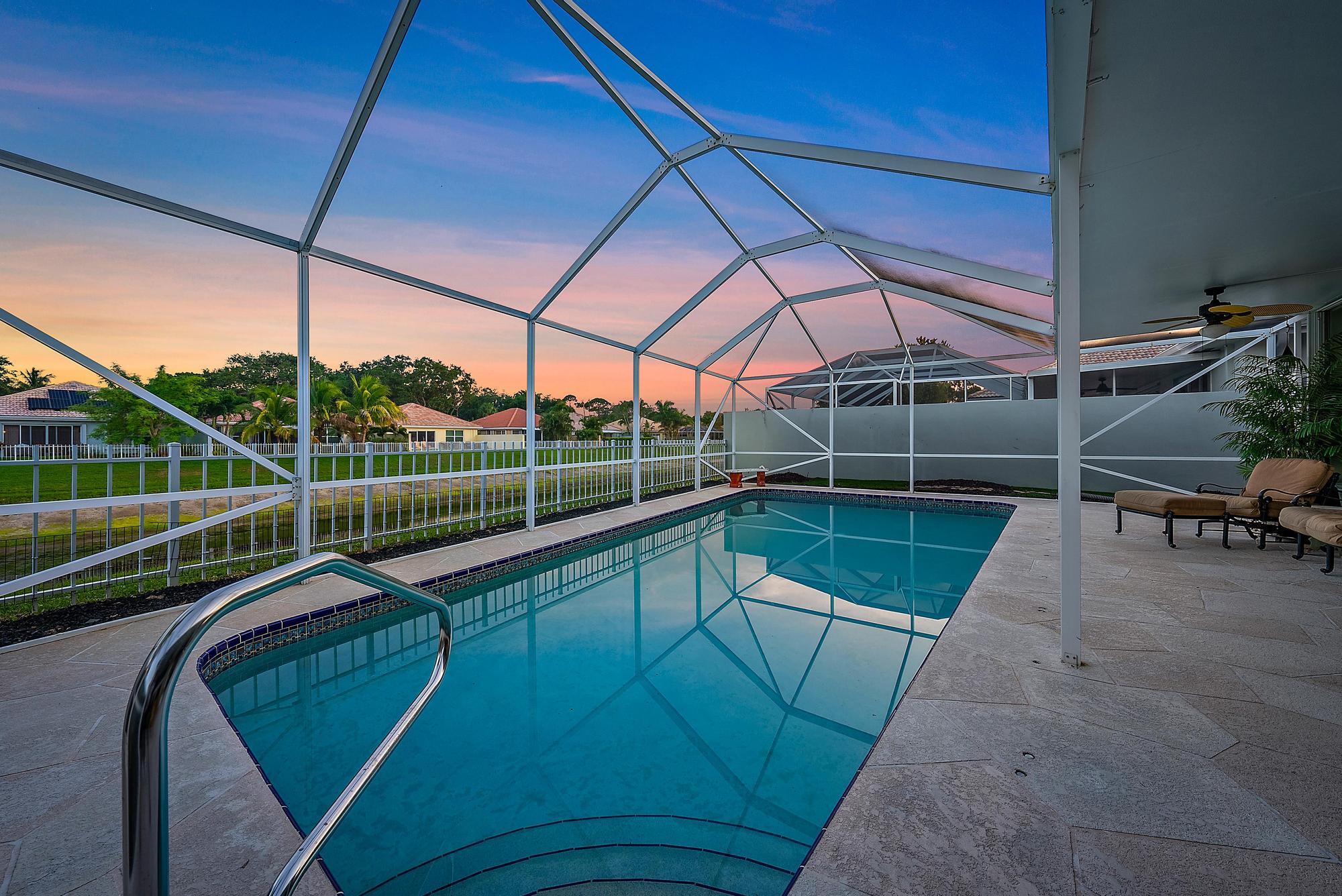 115 South Hampton Drive Jupiter, FL 33458 - Photo 6 of 27 a view of a swimming pool with a porch