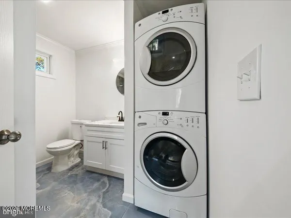 a view of a hallway with washer and dryer