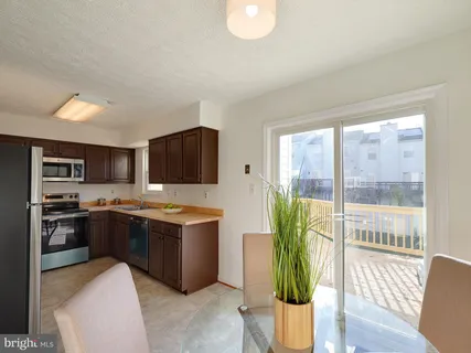 a kitchen with a stove and a refrigerator