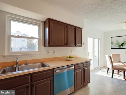 a kitchen with a sink and a window