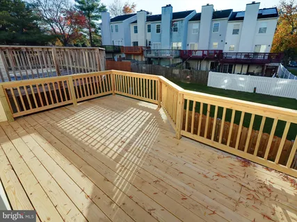 a view of balcony with wooden floor