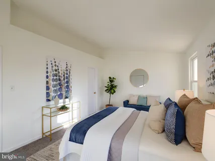 a bedroom with bed and a window