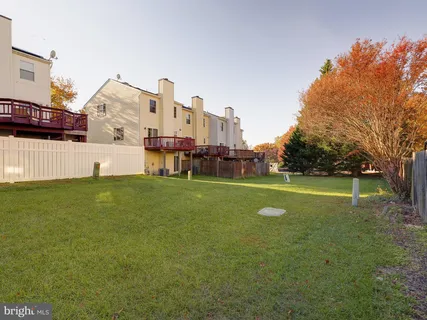 a view of a house with a wooden deck