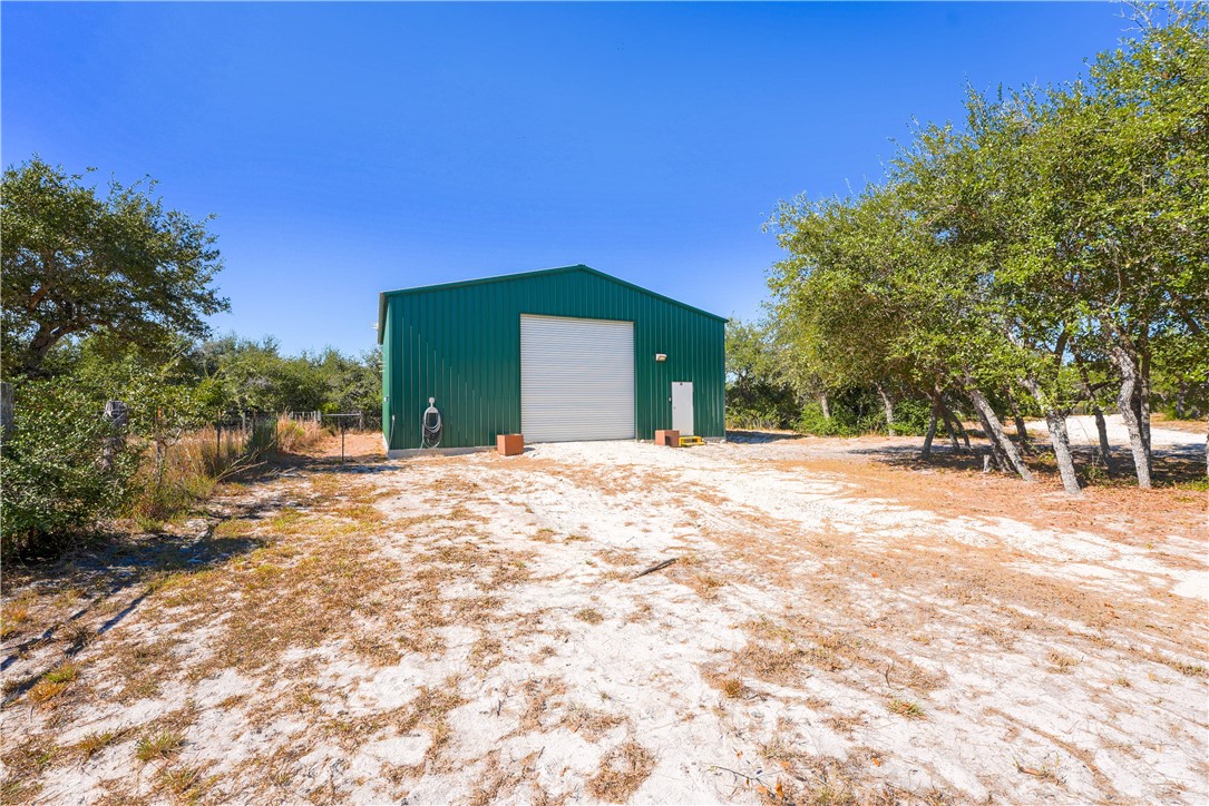 2122 Prairie Road Rockport, TX 78382 - Photo 1 of 11 a view of a white house with a yard