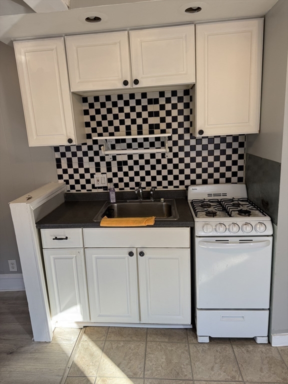 286 South Main Street, Unit 10 Haverhill, MA 01835 - Photo 3 of 11 a kitchen with a stove and a refrigerator