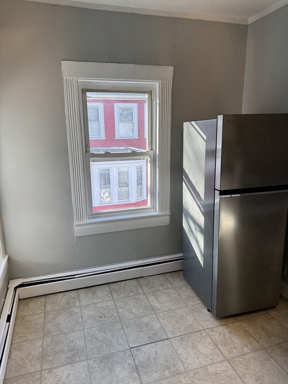 286 South Main Street, Unit 10 Haverhill, MA 01835 - Photo 4 of 11 a view of an empty room with a window