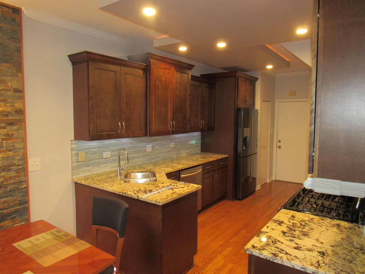 696 Western Lane Addison, IL 60101 - Photo 12 of 36 a kitchen with a sink and a refrigerator