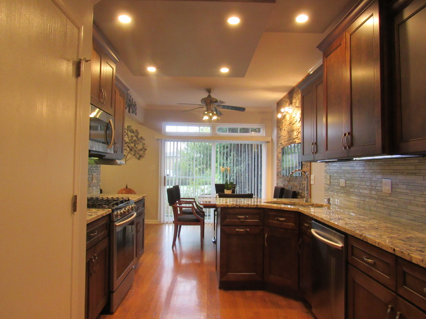 696 Western Lane Addison, IL 60101 - Photo 15 of 36 a kitchen with lots of counter top space and stainless steel appliances