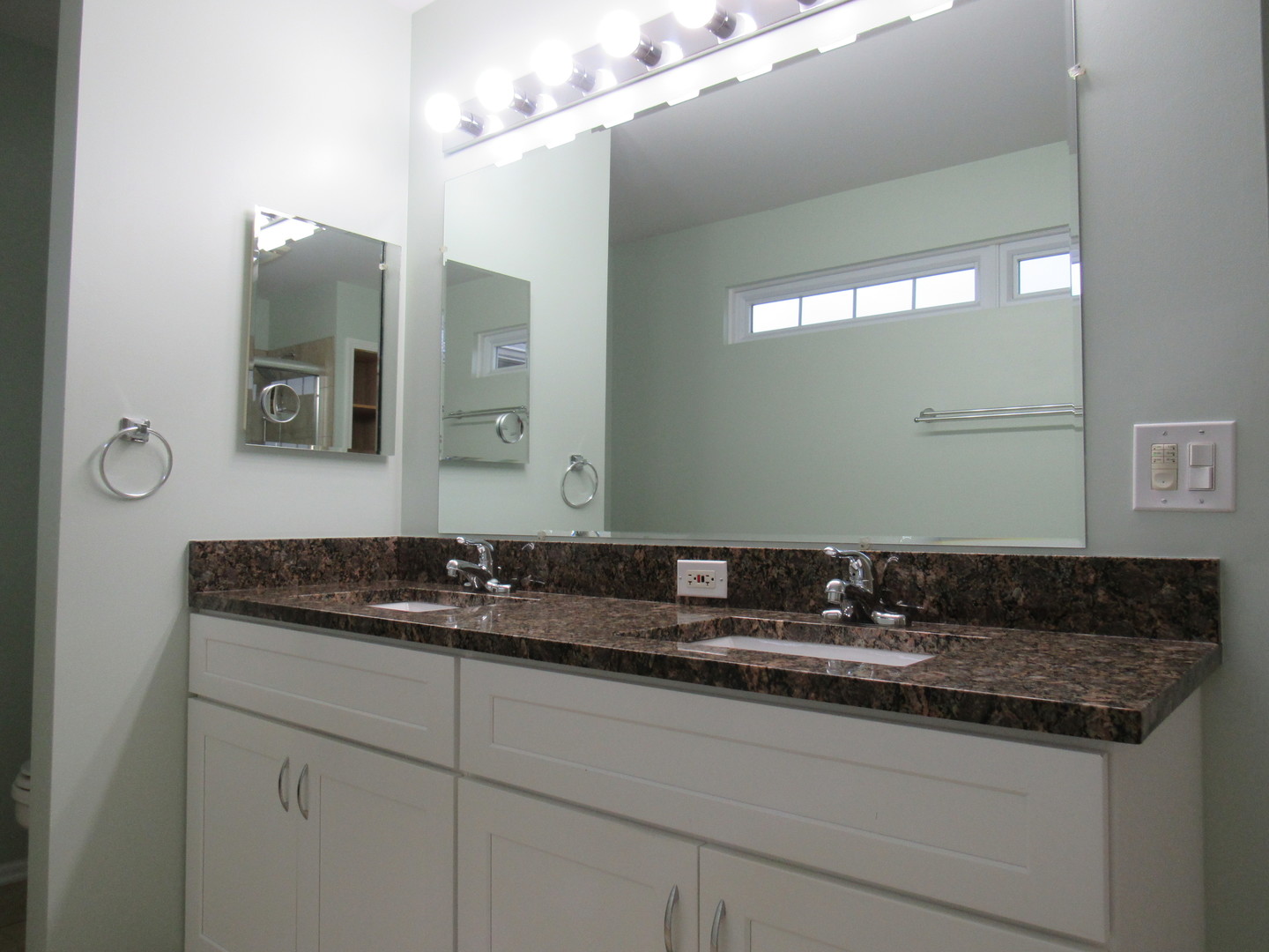 696 Western Lane Addison, IL 60101 - Photo 21 of 36 a bathroom with a granite countertop sink and a mirror