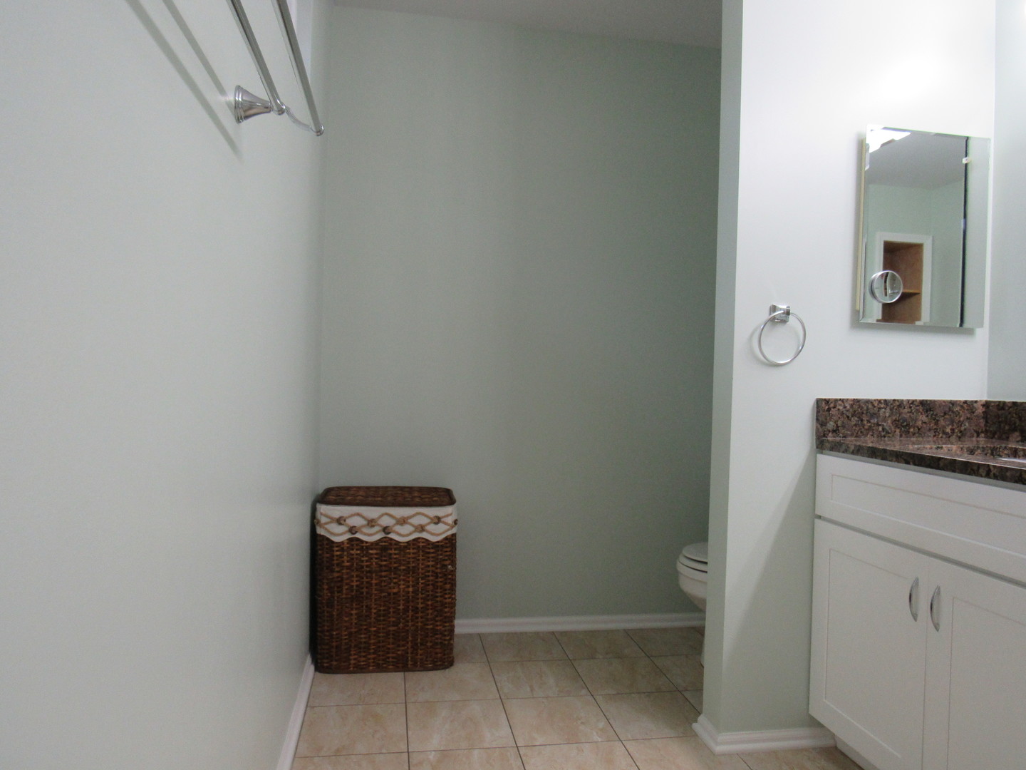 696 Western Lane Addison, IL 60101 - Photo 22 of 36 a view of a hallway with washer and dryer