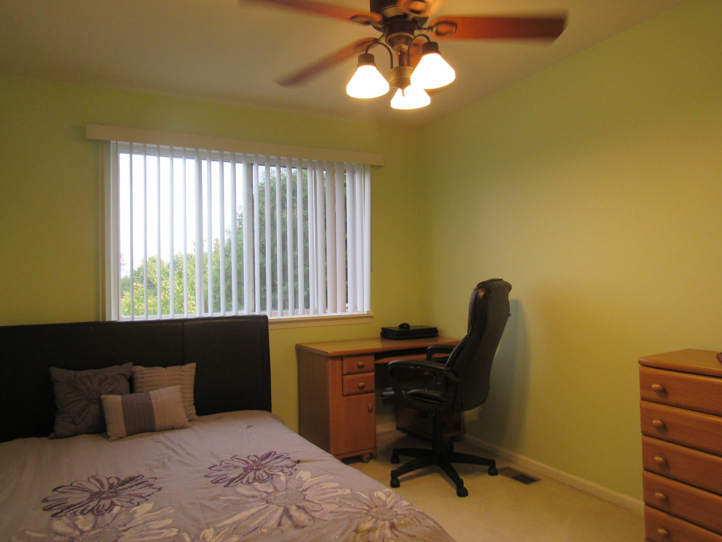 696 Western Lane Addison, IL 60101 - Photo 23 of 36 a bedroom with a bed and a window