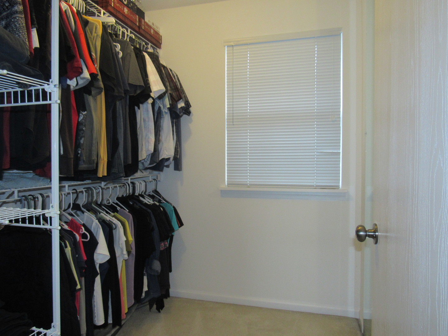 696 Western Lane Addison, IL 60101 - Photo 24 of 36 a view of walk in closet with clothes and shoes