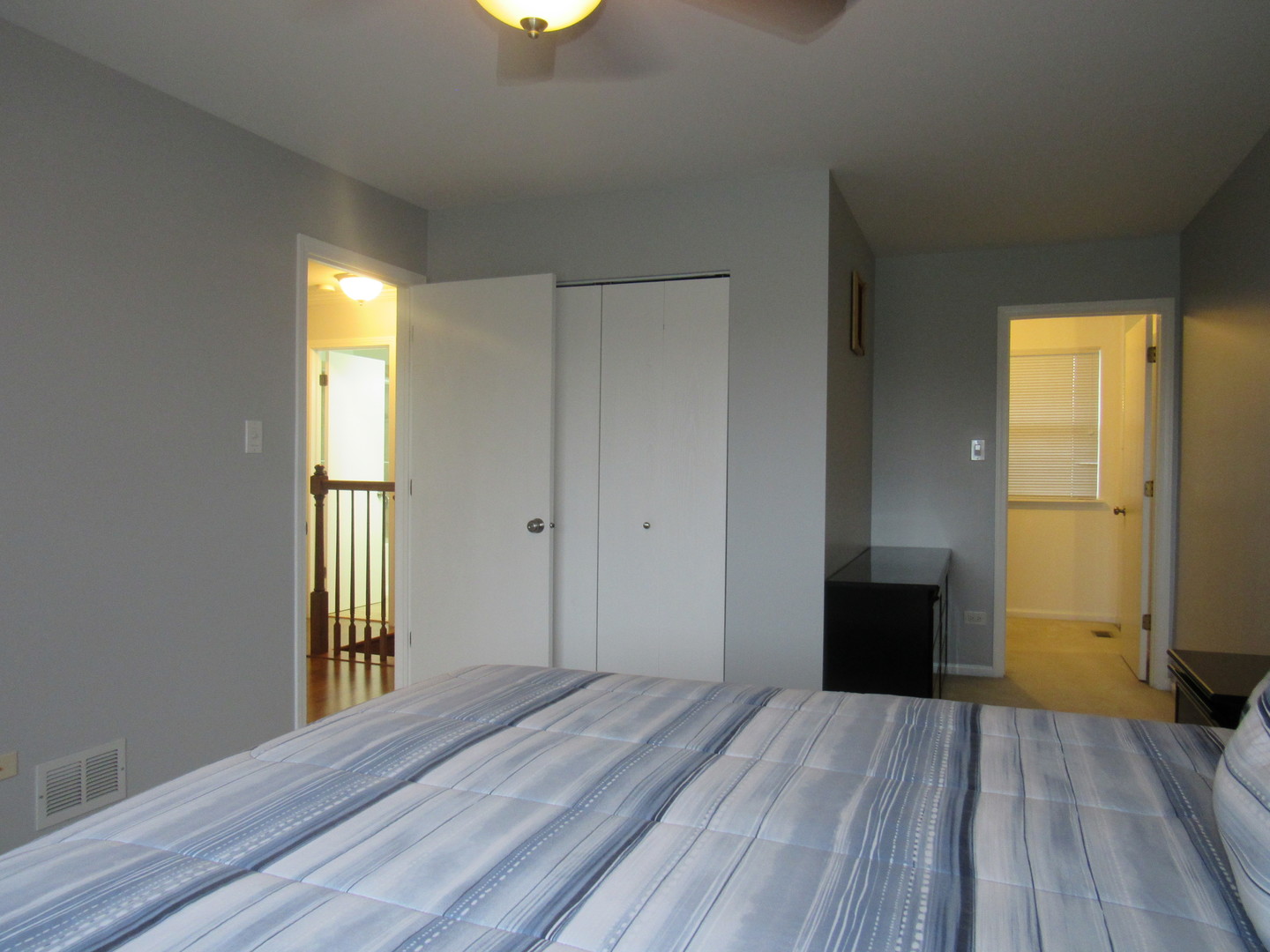 696 Western Lane Addison, IL 60101 - Photo 26 of 36 a view of empty room with wooden floor and fan