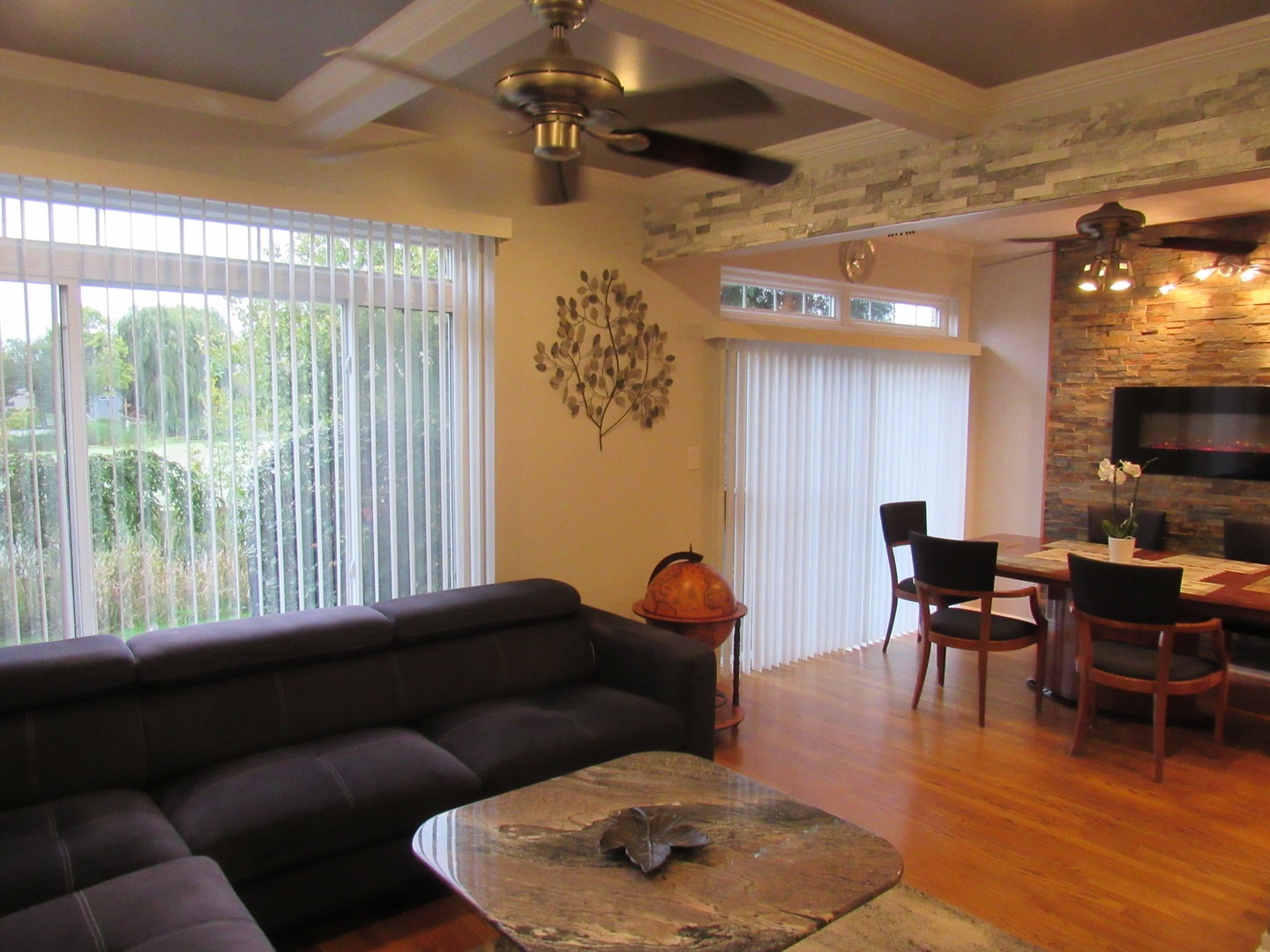 696 Western Lane Addison, IL 60101 - Photo 6 of 36 a living room with furniture and a flat screen tv