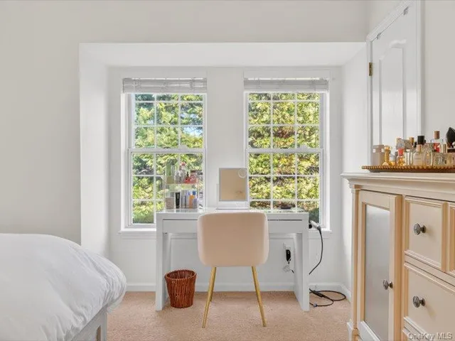 a bedroom with a bed and a table