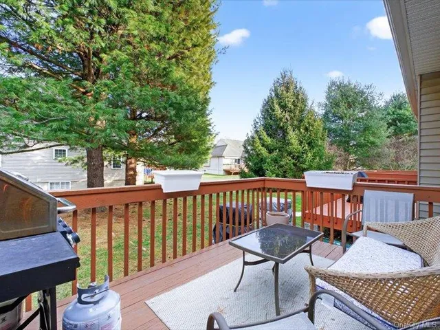 a view of a patio with a table and chairs
